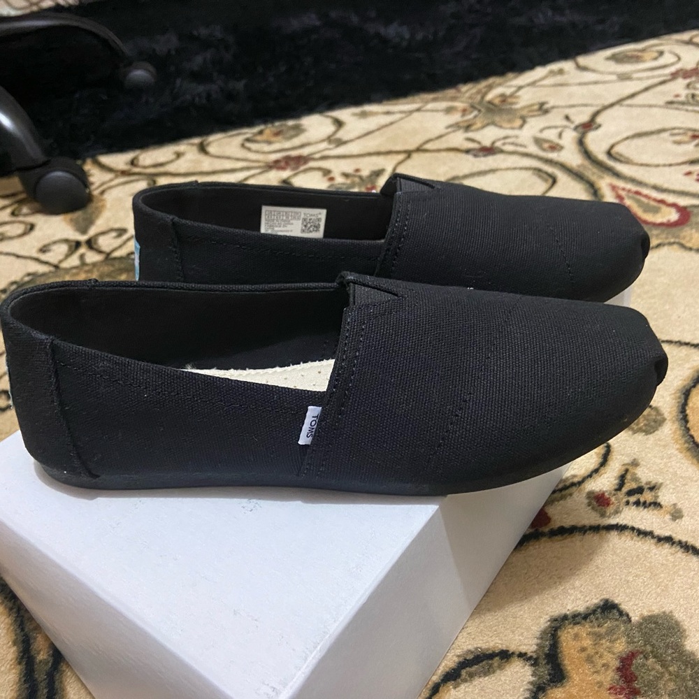 Toms - Black Classic Slip Ons never worn brand new